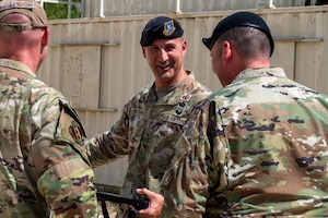 U.S. Air Force Chief Master Sgt. Brandon Wolfgang, Eighth Air Force command chief and Joint-Global Strike Operations Center senior enlisted leader, converses with 7th Bomb Wing Airmen during a base tour at Dyess Air Force Base, Texas, Sept. 2, 2025. Wolfgang is responsible to the 8th AF commander for the combined total force integration, utilization, readiness, assignment, morale and welfare of more than 24,000 joint warfighters. (U.S. Air Force photo by Airman 1st Class Adrien Tran)