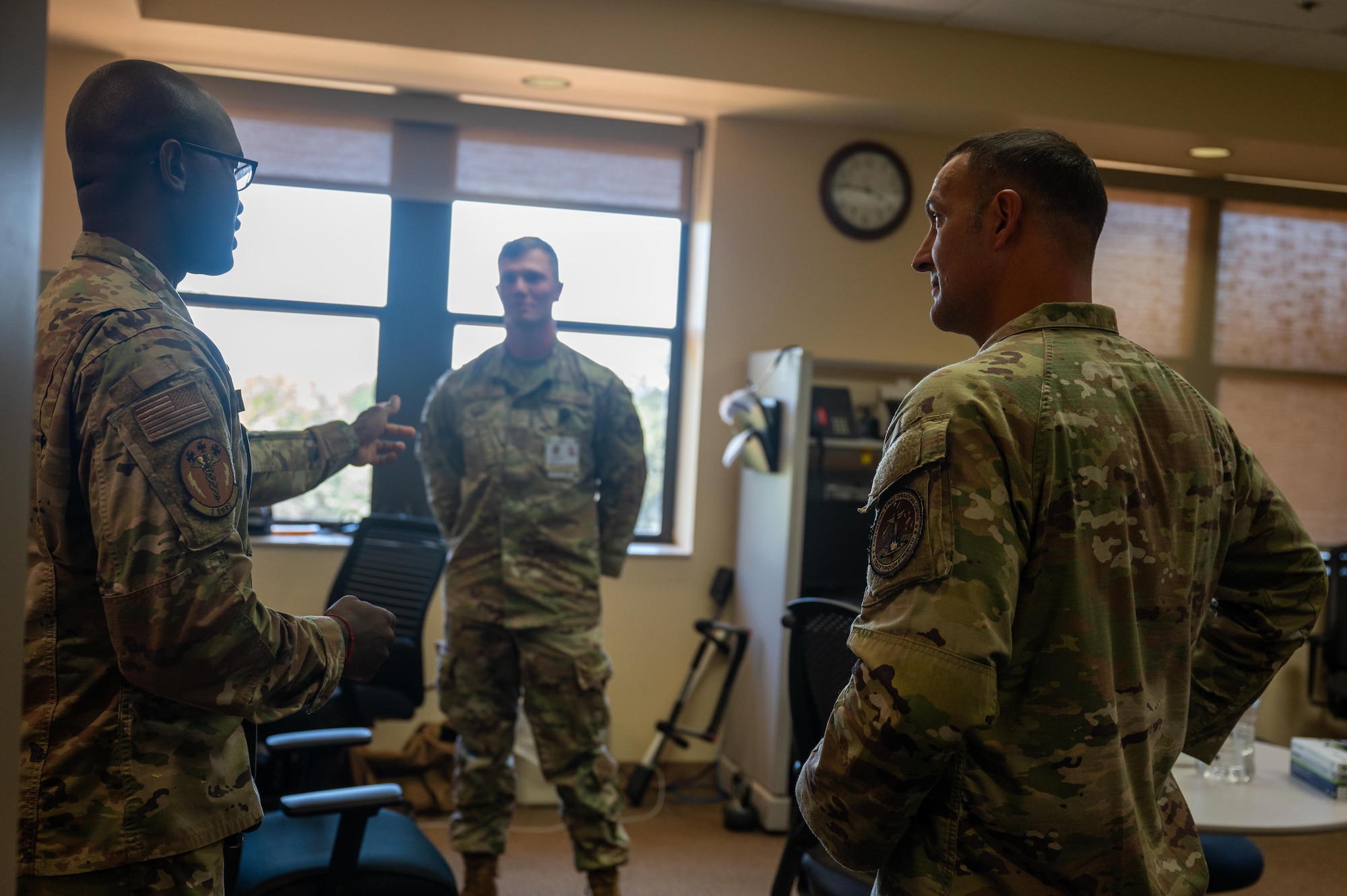 U.S. Air Force Senior Airman McBride Gerard, 7th Operational Medical Readiness Squadron medical technician, provides a tour of the 7th Medical Group medical clinic to Chief Master Sgt. Brandon Wolfgang, Eighth Air Force command chief and Joint-Global Strike Operations Center senior enlisted leader, at Dyess Air Force Base, Texas, Sept. 3, 2025. Wolfgang toured around Dyess to connect with Airmen across the bomb wing. (U.S. Air Force photo by Airman 1st Class Adrien Tran)