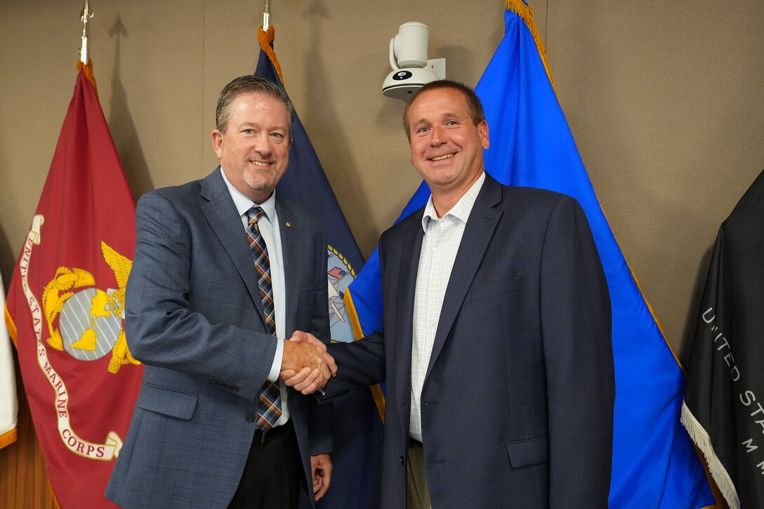 Two men shaking hands.