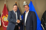 Two men shaking hands.