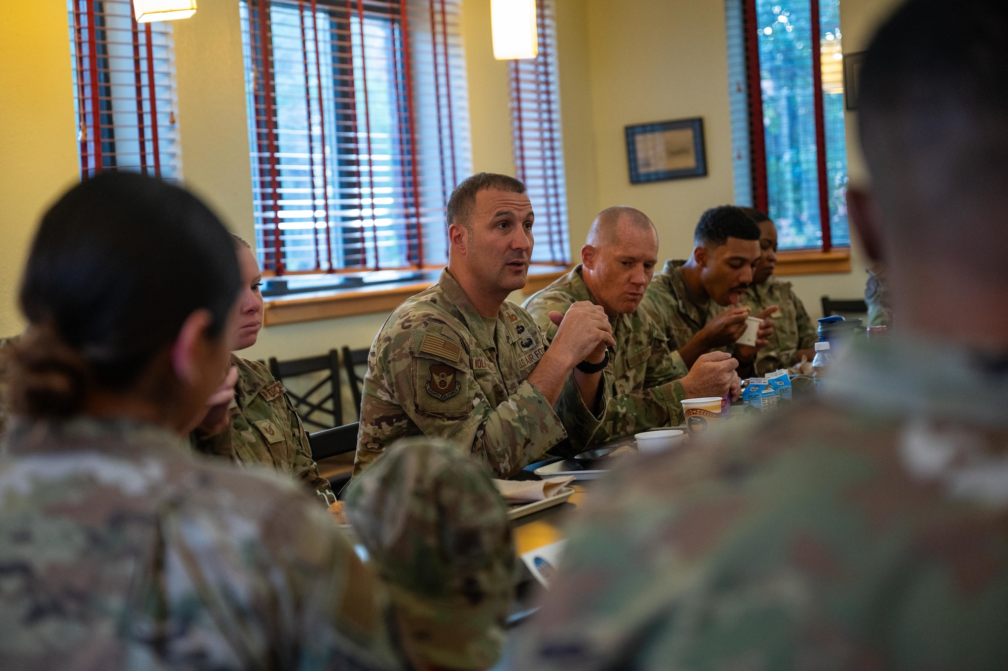 U.S. Air Force Chief Master Sgt. Brandon Wolfgang, Eighth Air Force command chief and Joint-Global Strike Operations Center senior enlisted leader, speaks with Airmen during a base tour at Dyess Air Force Base, Texas, Sept. 3, 2025. Wolfgang engaged directly with Airmen, gaining insight into their challenges, successes and dedication to the mission. (U.S. Air Force photo by Airman 1st Class Adrien Tran)