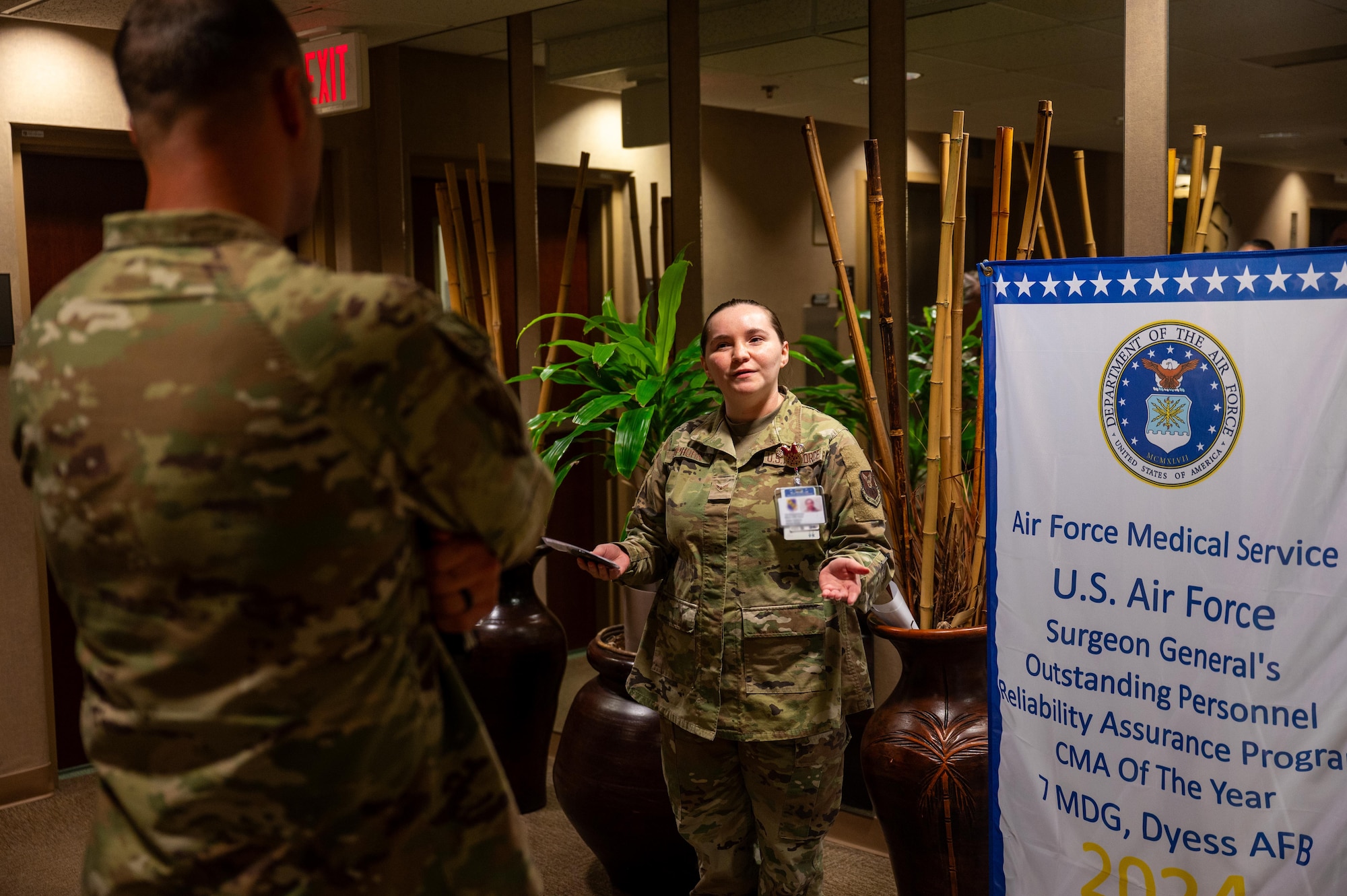 U.S. Air Force Airman 1st Class Amber Sophorn, 7th Operational Medical Readiness Squadron mental health technician, briefs Chief Master Sgt. Brandon Wolfgang, Eighth Air Force command chief and Joint-Global Strike Operations Center senior enlisted leader, during a base tour at Dyess Air Force Base, Texas, Sept. 3, 2025. Wolfgang immersed himself in the daily operations of the 7th Bomb Wing, connecting with the Airmen who power the mission. (U.S. Air Force photo by Airman 1st Class Adrien Tran)