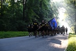 Virginia Army National Guard Soldiers assigned to the state’s Recruiting and Retention Battalion conduct a battalion run June 27, 2025, at the State Military Reservation in Virginia Beach, Virginia. The battalion came together for a week of training at SMR to focus on professional development, sharing best practices and building esprit de corps. (U.S. Army National Guard photo by Sgt. 1st Class Terra C. Gatti)