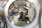 Navy Diver 1st Class Josh Amberson, right, and Navy Diver 2nd Class Hale Gage conduct a simulated emergency inside the new hyperbaric chamber, July 29, 2025, at Naval Base Kitsap-Bangor, Washington. (U.S. Navy photo by Wendy Hallmark)