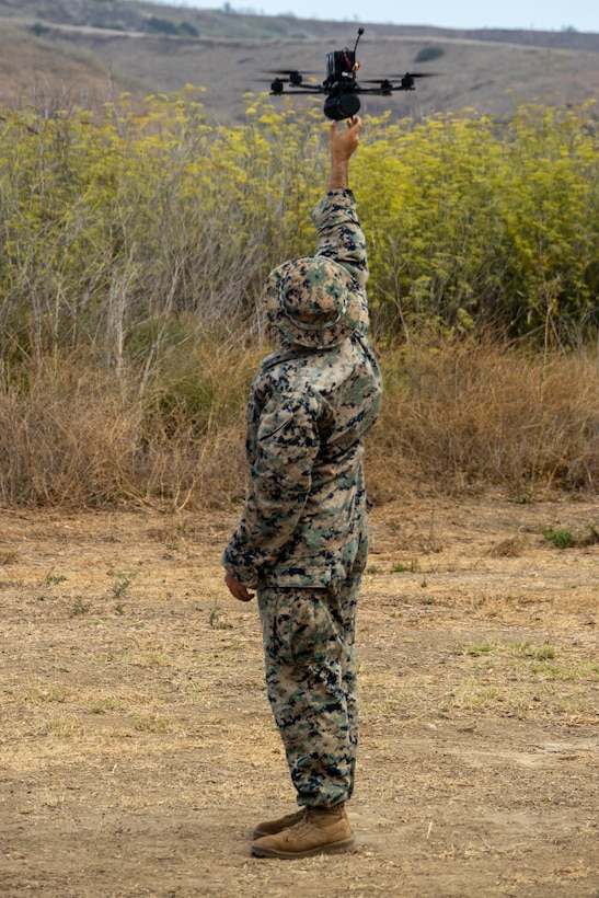 U.S. Marine Corps Cpl. Eduardo Montano Lopez, a rifleman with 1st Marine Division Schools, launches a small unmanned aircraft system during Project G.I. at Marine Corps Base Camp Pendleton, California, Aug. 25, 2025. The Defense Innovation Unit’s Project G.I. Challenge brought together Marines with I Marine Expeditionary Force, industry partners, and Department of Defense leaders to evaluate commercial sUAS, with Marine feedback shaping future procurement decisions and advancing modernization for contested environments. Montano Lopez is a native of Mexico. (U.S. Marine Corps photo by Sgt. Adeola Adetimehin)
