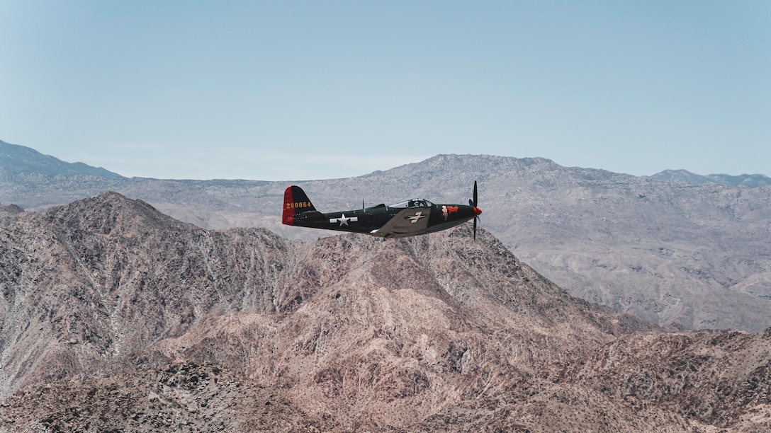 A North American Bell P-63 Kingcobra American fighter aircraft, participates in a Memorial Day ceremonial flyover at Palm Springs, Calif., May 25, 2020. Five burial flags were presented and flown over Southern California in historic aircraft to commemorate fallen American service members for Memorial Day.
