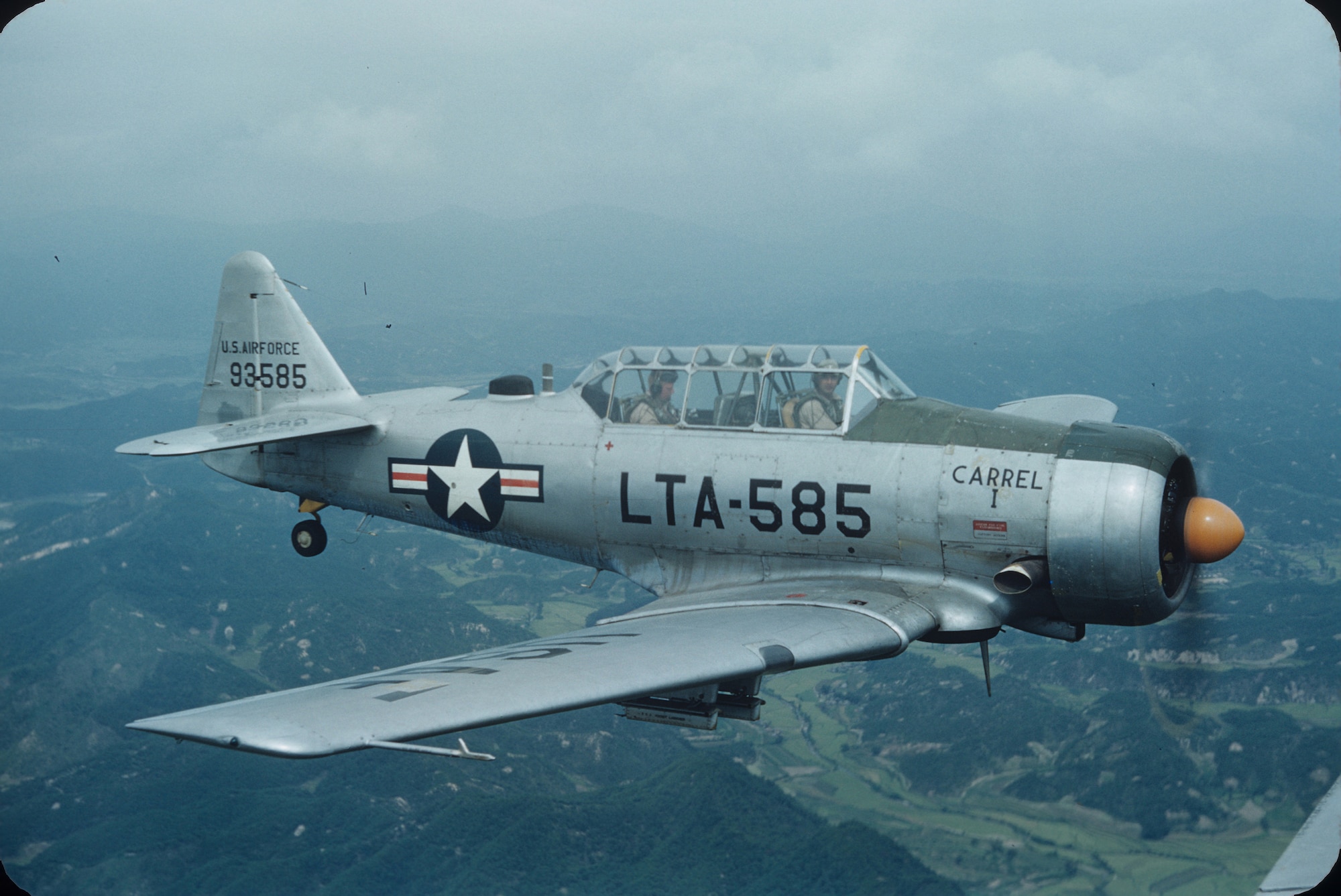 A U.S. Air Force LT-6G aircraft flies in the demilitarized zone over South Korea in the fall of 1953. The North American Aviation T-6 Texan was modified during the Korean War for battlefield surveillance and forward air control, and designated as T-6 "Mosquitos."