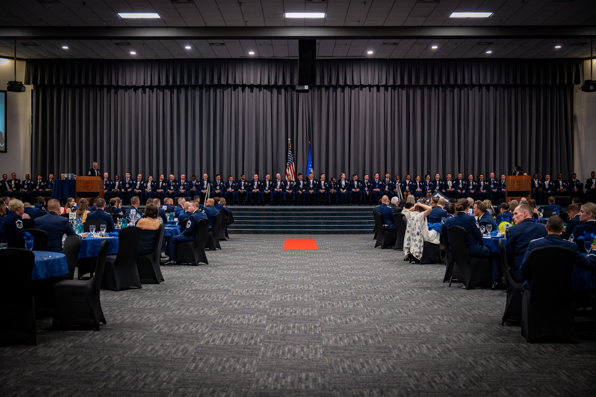 U.S. Air Force Airmen assigned to Air Force Global Strike Command, Eighth Air Force, and 2nd Bomb Wing take a group photo during the Senior Noncommissioned Officer Induction Ceremony at Barksdale Air Force Base, Louisiana, Sept. 4, 2025. The SNCO Induction Ceremony celebrated and welcomed over 50 newly selected SNCOS into the highest tier of enlisted Airmen. (U.S. Air Force photo by Airman 1st Class Devyn Taylor)
