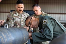 U.S. Air Force Gen. Adrian Spain, commander of Air Combat Command (ACC) assembles a GBU-38 bomb during a visit to Beale Air Base, California, Sept. 5th, 2025. Spain visited the 9th Munitions Squadron’s Air Force Combat Ammunition Center main staging area as part of an immersive tour of the 9th Reconnaissance Wing. The visit deepened his understanding of the critical role the wing plays to advance ACC’s mission by providing high altitude reconnaissance, mission ready airmen, and combat ammunition expertise to combatant commands, while integrating resilient installation services. (U.S. Air Force photo by Staff Sgt. Christopher Chen)