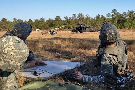 Soldiers from 2nd Platoon, Alpha Battery, 1-319th Airborne Field Artillery Regiment, participates in live air assault operations training at Fort Bragg, North Carolina in 2012.