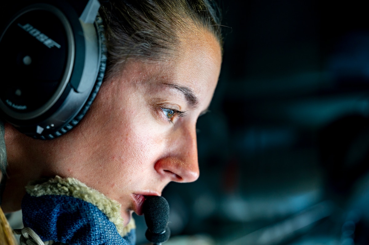 U.S. Air Force Staff Sgt. Addie Braden, an in-flight refueling specialist with the 121st Air Refueling Wing, prepares to refuel an F-16 Fighting Falcon.