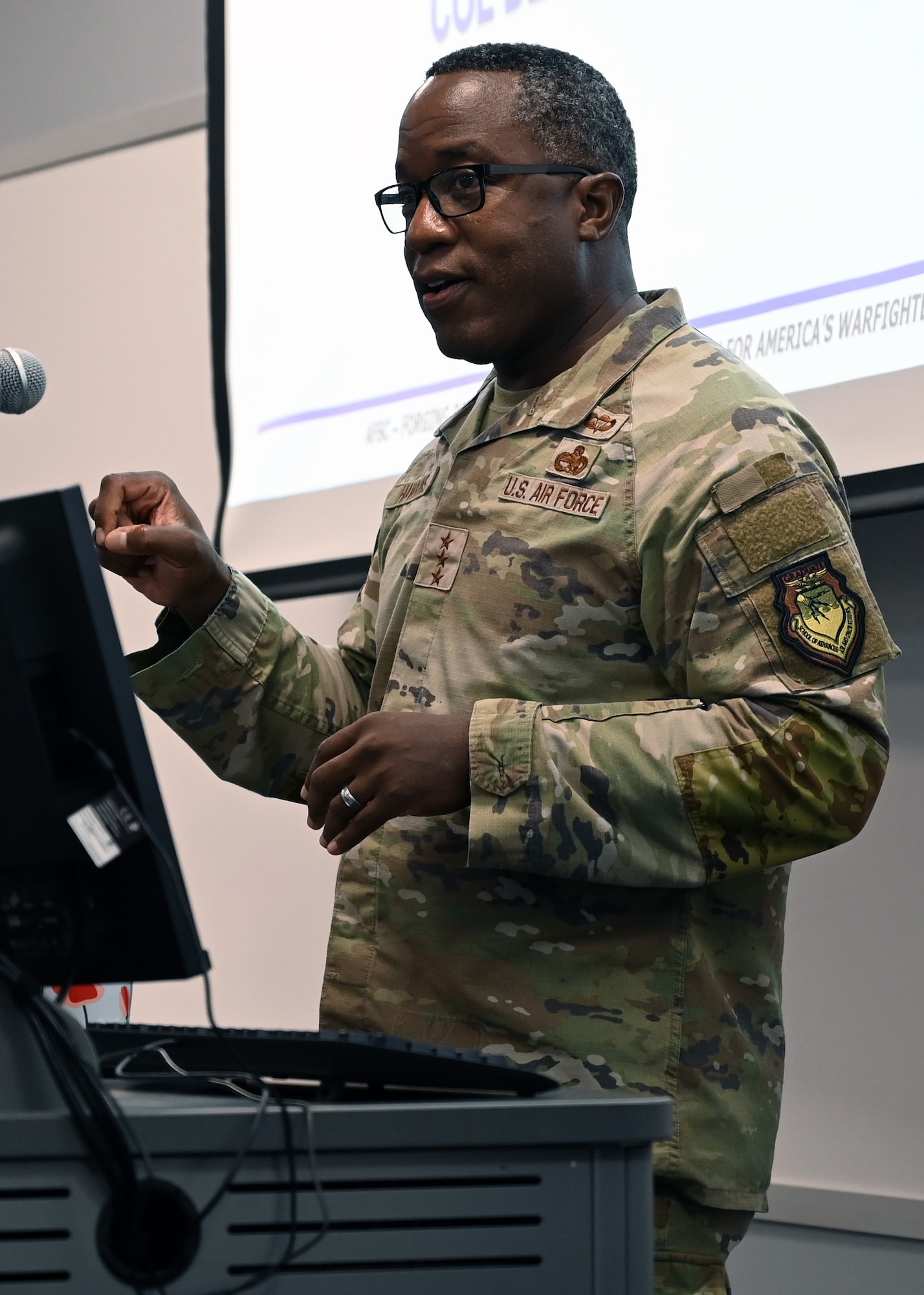 A military general giving a presentation.
