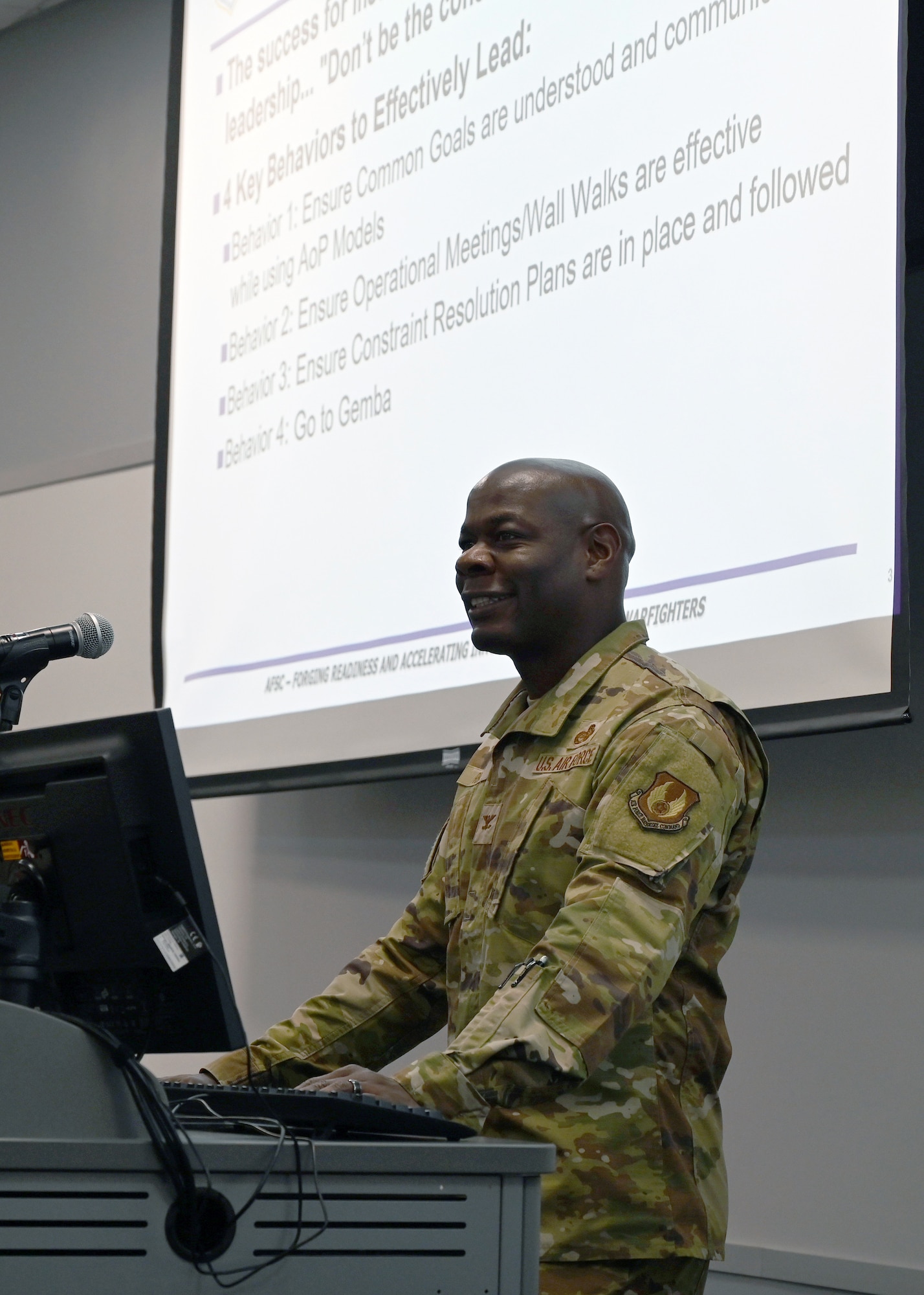 A military commander giving a presentation.