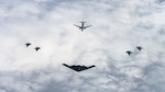 A U.S. Air Force B-2 Spirit, center, from the 72d Test and Evaluation Squadron assigned to the 53rd Wing, a Royal Norwegian Air Force P-8 Poseidon, center back, and four Royal Norwegian Air Force F-35 Lightning II, right and left, fly in formation over Norway, Sept. 3, 2025. The U.S. partnered with Norwegian Allies to test next-generation precision maritime strike capabilities. The event advanced tactics, techniques, and procedures for long-range sensor-to-shooter operations. (U.S. Air Force Photo by Tech. Sgt. Jesenia Landaverde)
