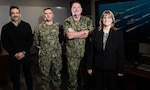 From left: Naval Surface Warfare Center Dahlgren Division (NSWCDD) Warfighting Readiness and Response Lead Rob Ward, Battle Watch Commander Lt. Adam Bibeau, Commanding Officer Capt. Joe Oravec and Technical Director (Acting) Shawna McCreary showcased one of the war rooms. The room serves as the center location for the Crisis Response Center at NSWCDD. (Dorina Watermolen/NSWCDD Photo)