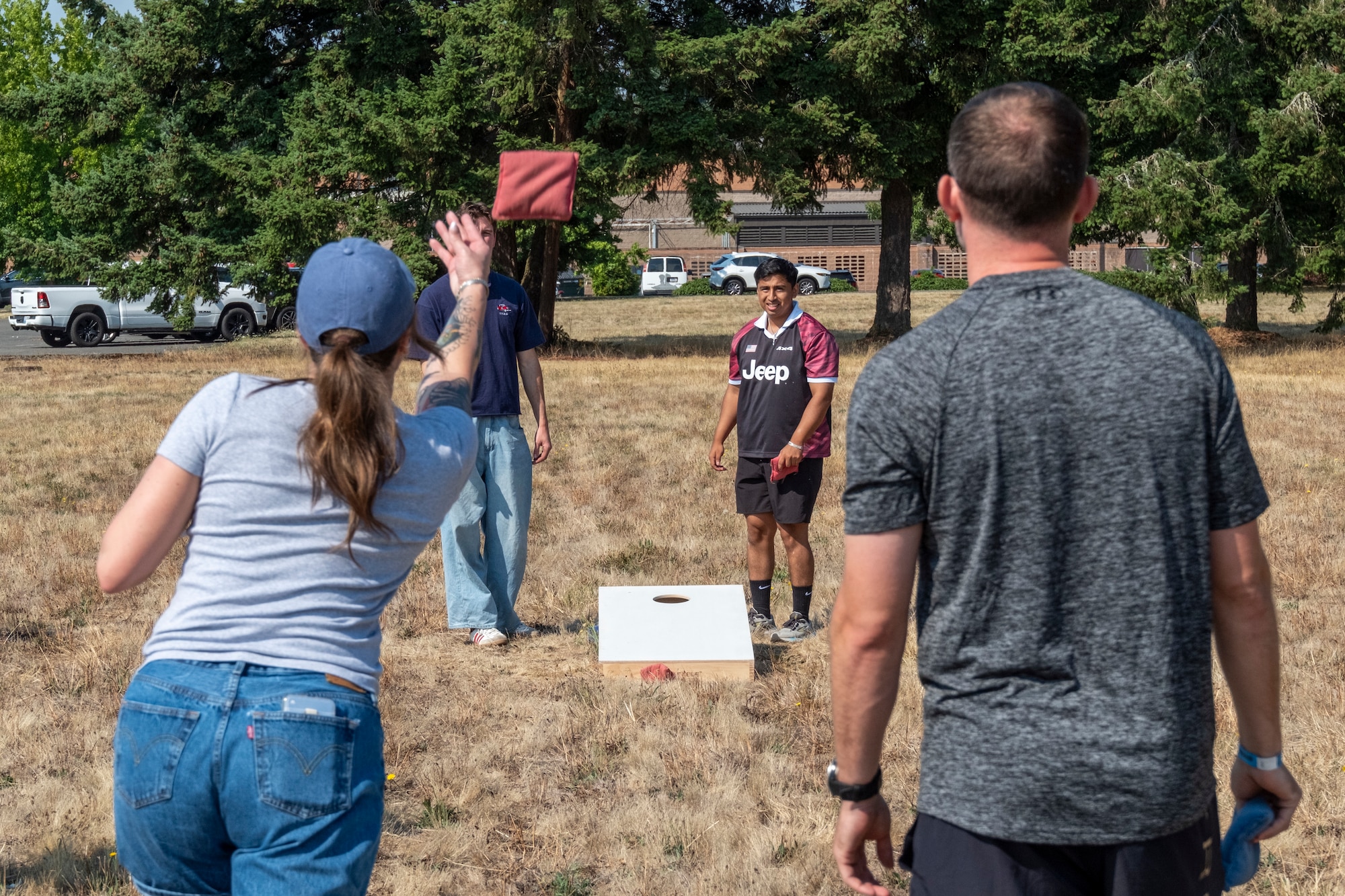 Team McChord Airmen play cornhole during the 2025 Team McChord Summer Block Party at Joint Base Lewis-McChord, Washington, Aug. 28, 2025.
