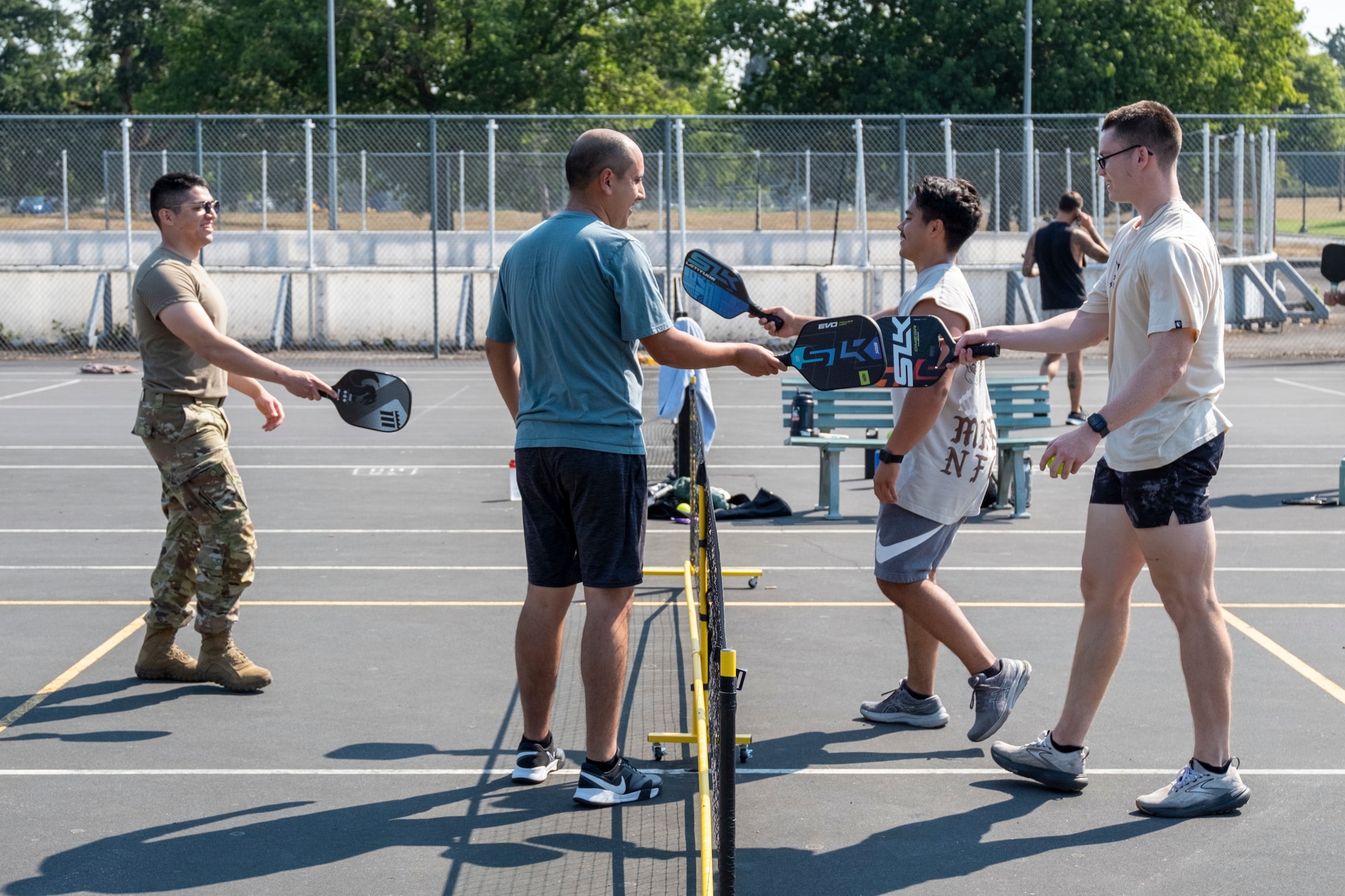 Team McChord Airmen finish a game of pickleball during the 2025 Team McChord Summer Block Party at Joint Base Lewis-McChord, Washington, Aug. 28, 2025.