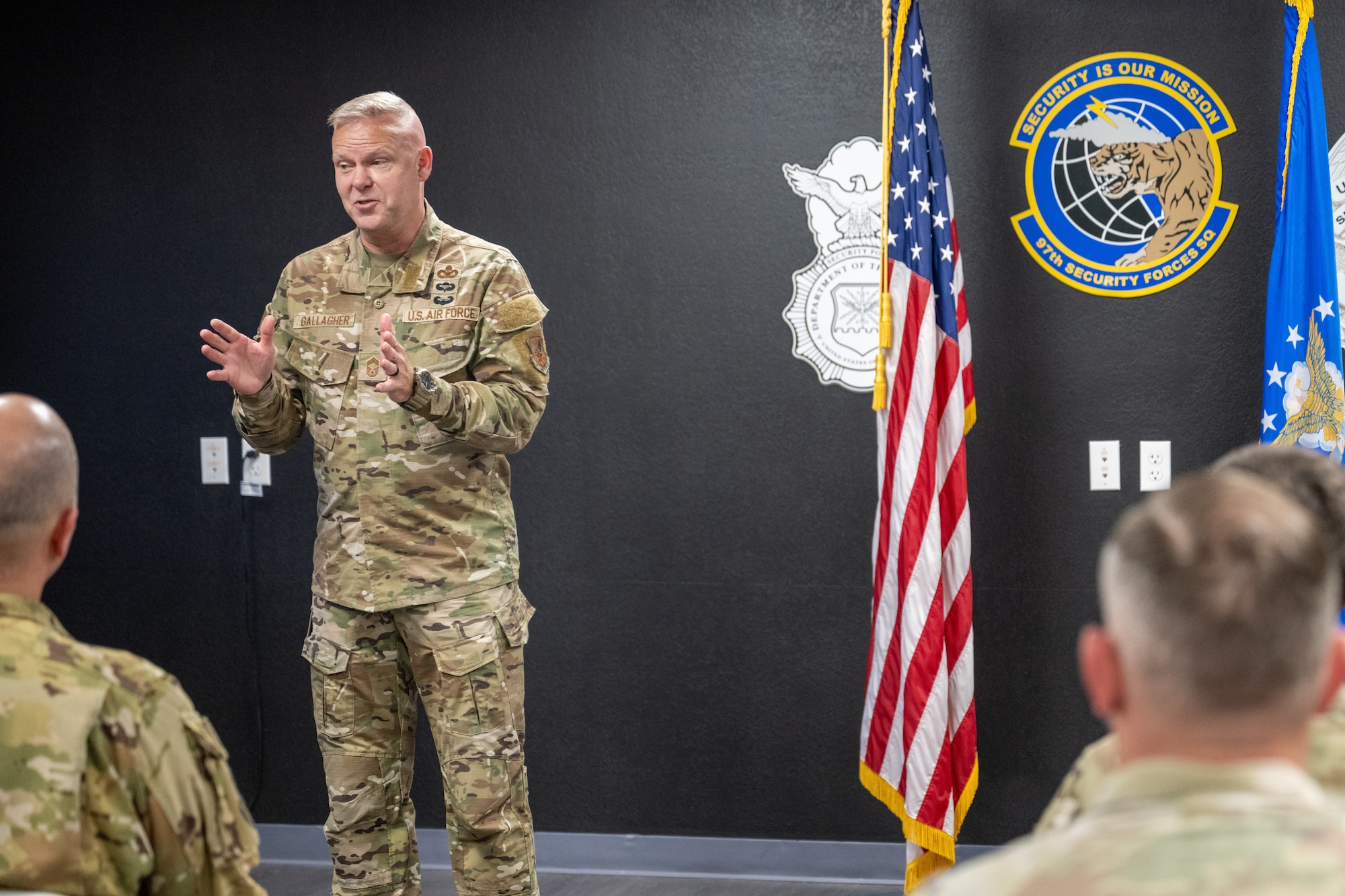 U.S. Air Force Chief Master Sgt. Donald S. Gallagher, Security Forces career field manager, answers career field questions from 97th Security Forces Squadron (SFS) defenders at Altus Air Force Base (AFB), Oklahoma, Sept. 4, 2025. Gallagher was visiting Altus AFB to present an award to the 97th SFS for being the Air Force’s Best Medium-Sized SFS. (U.S. Air Force photo by Airman 1st Class Nathan Langston)