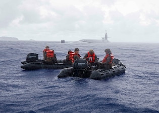 U.S. Marines with the 3rd Reconnaissance Battalion, 3rd Marine Division, conduct combat rubber reconnaissance craft training with the Ohio-class guided-missile submarine USS Ohio (SSGN 726), in the Philippine Sea, Sept. 3, 2025.
