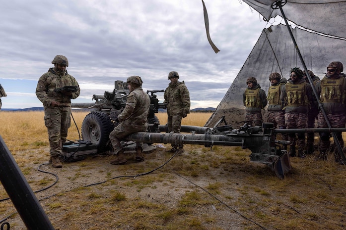 Soldiers assigned to 2nd Battalion, 8th Field Artillery Regiment, 1st Infantry Brigade Combat Team (Arctic), 11th Airborne Division conduct pre-fire checks on a M119 Howitzer as Indian Army soldiers observe at Yukon Training Area, Alaska, Sept. 6 2025 during Exercise Yudh Abhyas 25.