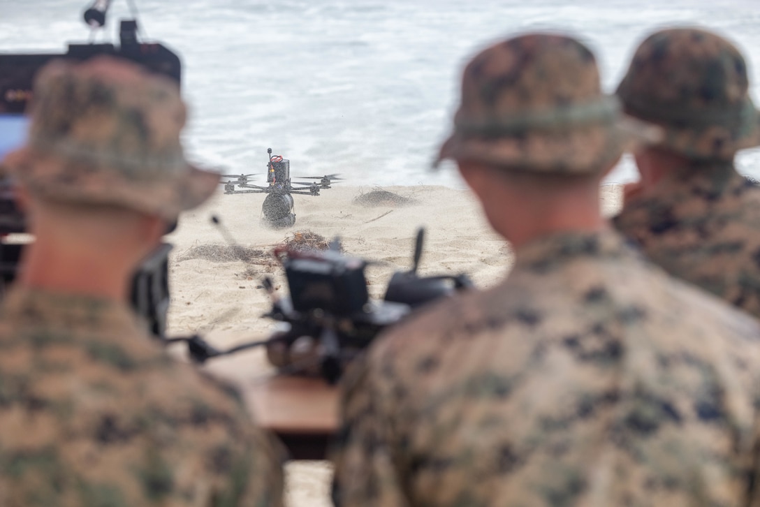 U.S. Marines with 1st Marine Division watch a vendor loaned small unmanned aircraft system fly during Project G.I. at Marine Corps Base Camp Pendleton, California, Aug. 26, 2025.  The Defense Innovation Unit’s Project G.I. Challenge brought together Marines with I Marine Expeditionary Force, industry partners, and Department of Defense leaders to evaluate commercial sUAS, with Marine feedback shaping future procurement decisions and advancing modernization for contested environments. (U.S. Marine Corps photo by Lance Cpl. Sawyer Carleton)