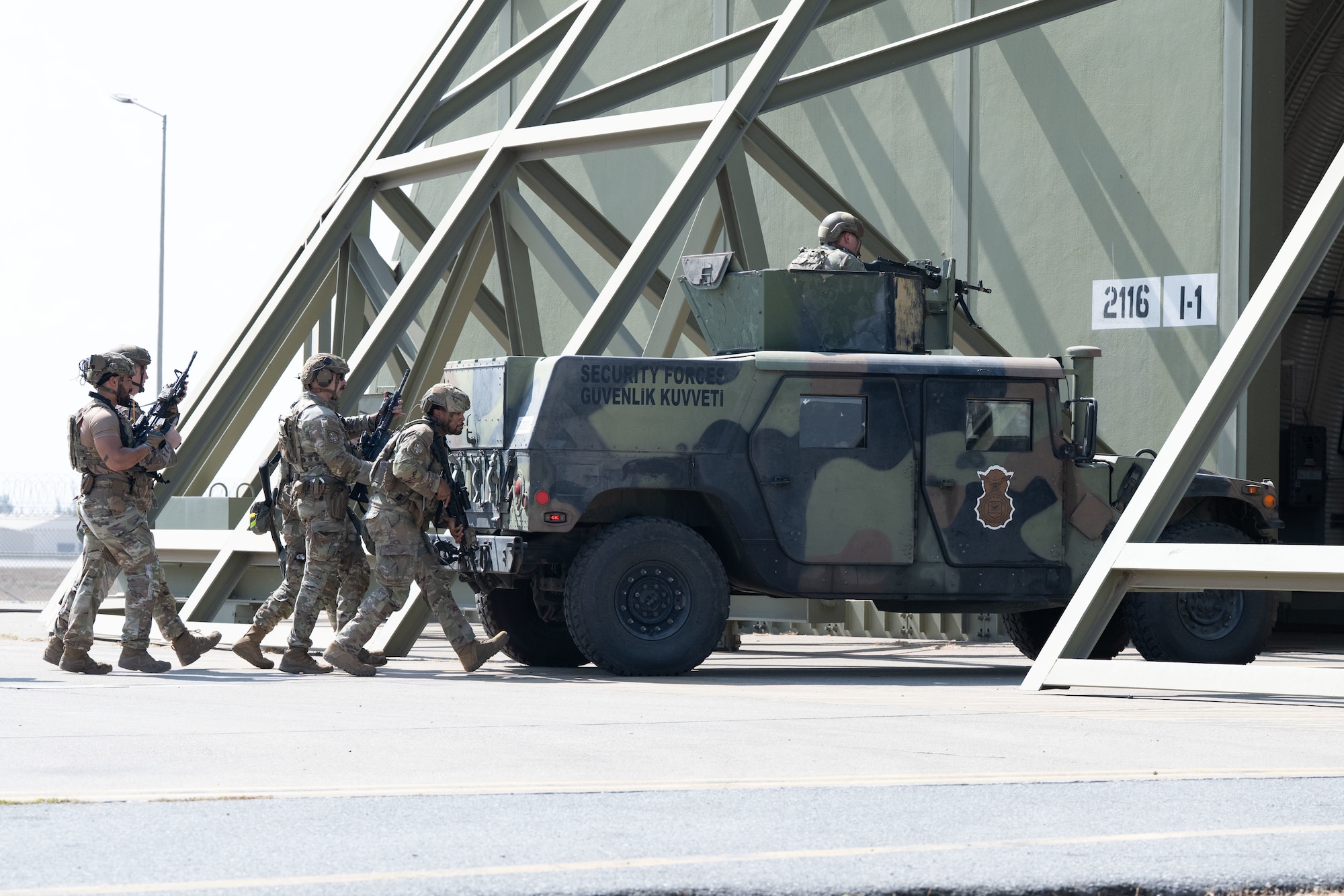 39th Security Forces Squadron Airmen enter a secure area during Exercise Titan Shield 25-09 at Incirlik Air Base, Türkiye, Sept. 9, 2025. A simulated ground attack during the exercise challenged the 39th SFS to demonstrate their ability to defend the base and maintain mission readiness in critical conditions. (U.S. Air Force photo by Senior Airman Greydon Furstenau)