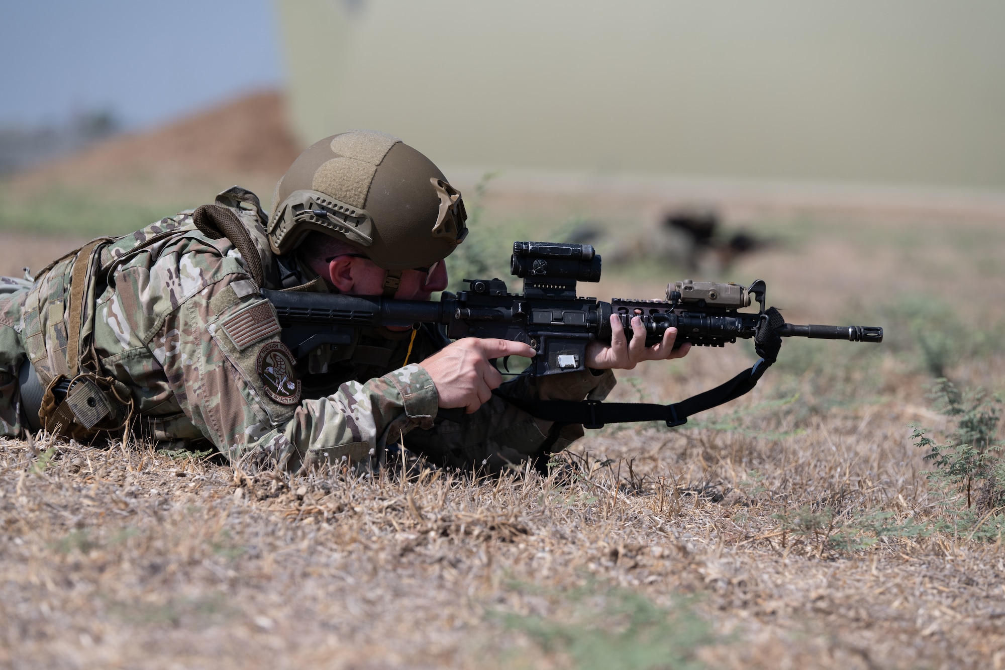 A 39th Security Forces Squadron Airman lays in the firing position during Exercise Titan Shield 25-09 at Incirlik Air Base, Türkiye, Sept. 9, 2025. A simulated ground attack during the exercise challenged the 39th SFS to demonstrate their ability to defend the base and maintain mission readiness in critical conditions. (U.S. Air Force photo by Senior Airman Greydon Furstenau)