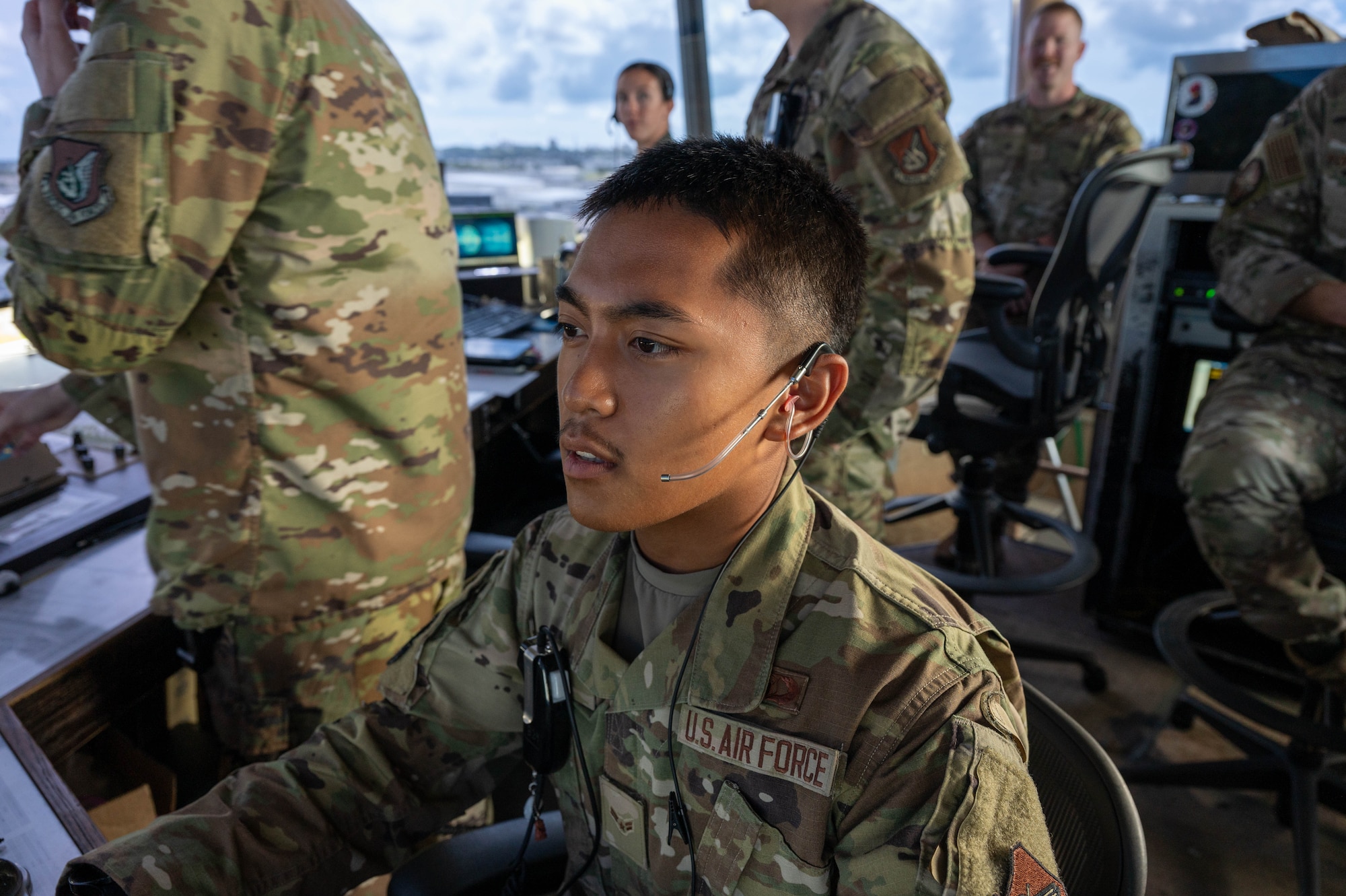 Service member checks over monitor.