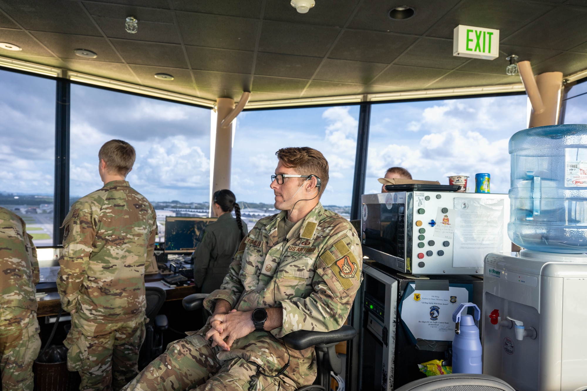 Service member overlooking others work.