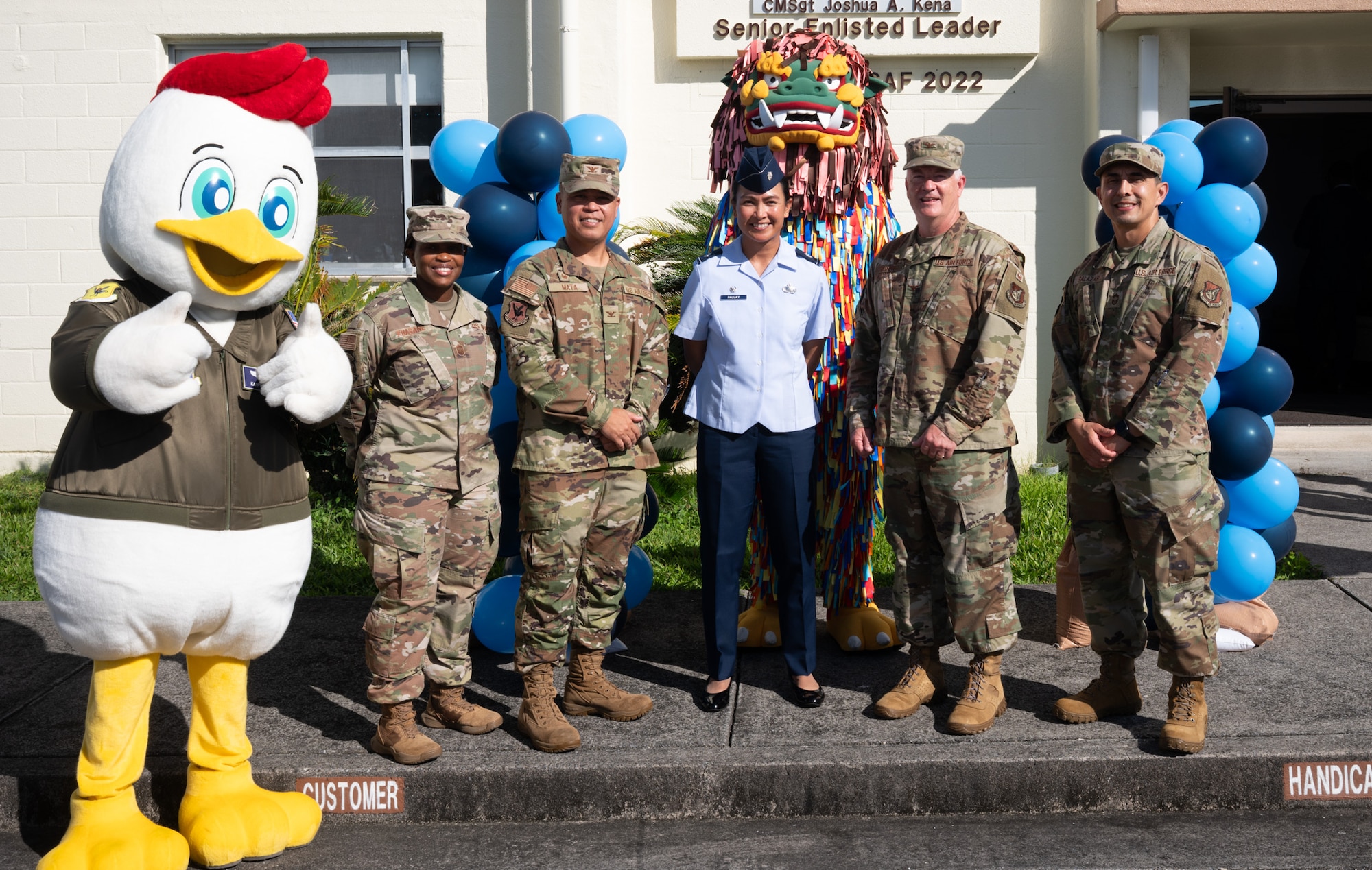 U.S. Air Force members and mascots pose for a photo