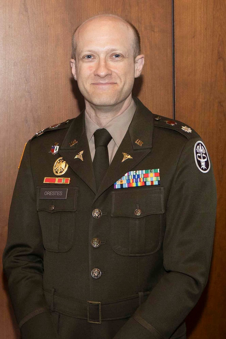U.S. Army Lt. Col. Michael Orestes, director for Education, Training, and Research (DETR), poses for a photo at a research program award ceremony at Walter Reed, May 22, 2025. The annual event brings together top researchers across the Department of Defense to showcase advances in health care and military science.