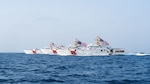 220822-A-KS490-1178 STRAIT OF HORMUZ (Aug. 22, 2022) From the left, U.S. Coast Guard fast response cutters USCGC Glen Harris (WPC 1144), USCGC John Scheuerman (WPC 1146), USCGC Emlen Tunnell (WPC 1145) and USCGC Clarence Sutphin Jr. (WPC 1147) transit the Strait of Hormuz, Aug. 22. The cutters are deployed to the U.S. 5th Fleet area of operations to help ensure maritime security and stability in the Middle East region. (U.S. Army photo by Spc. Noah Martin)