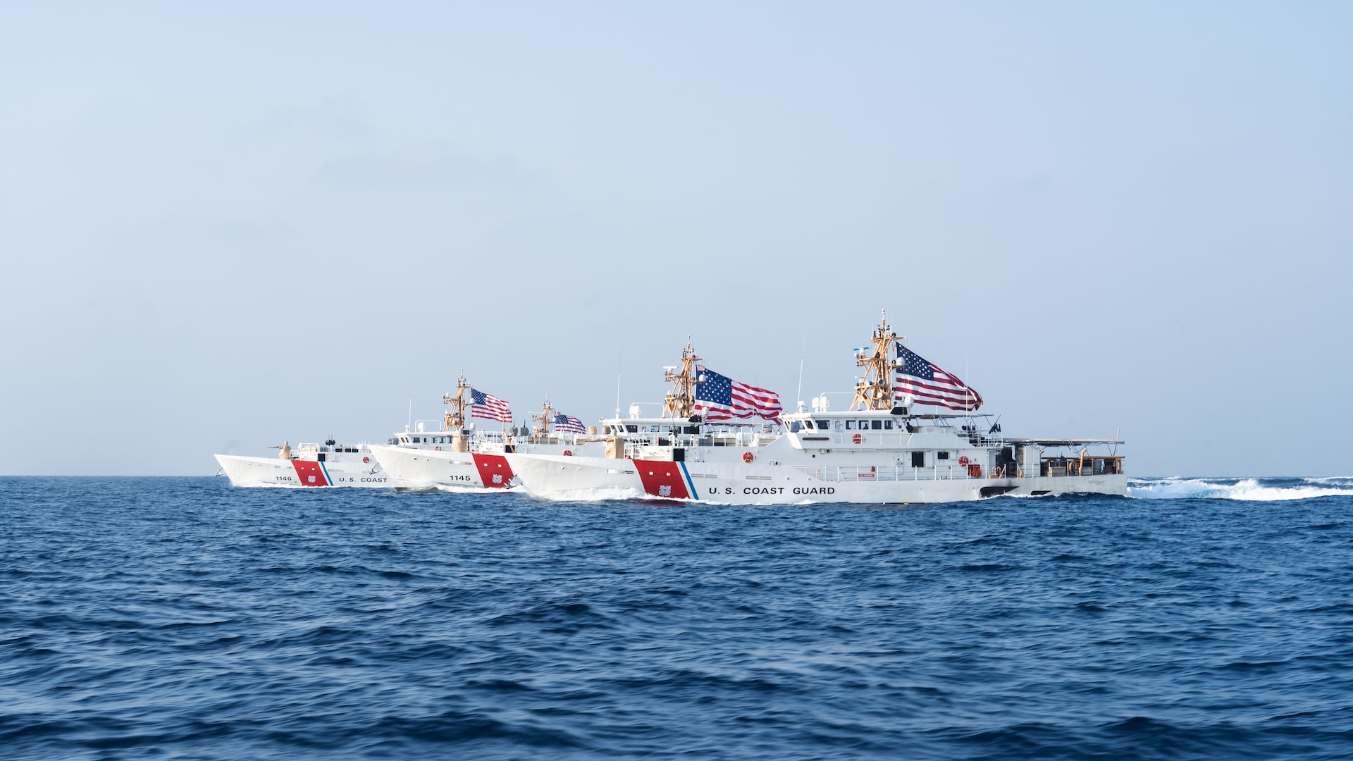 220822-A-KS490-1178 STRAIT OF HORMUZ (Aug. 22, 2022) From the left, U.S. Coast Guard fast response cutters USCGC Glen Harris (WPC 1144), USCGC John Scheuerman (WPC 1146), USCGC Emlen Tunnell (WPC 1145) and USCGC Clarence Sutphin Jr. (WPC 1147) transit the Strait of Hormuz, Aug. 22. The cutters are deployed to the U.S. 5th Fleet area of operations to help ensure maritime security and stability in the Middle East region. (U.S. Army photo by Spc. Noah Martin)