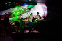 U.S. Marine Corps Sgt. Elizabeth Marino, (center) a vocalist, Cpl. Anthony Russo,(left) a bass guitarist and Cpl. Jabari Noel, a guitarist with the 2D Marine Aircraft Wing Band with the popular music group, assigned to Special Purpose Marine Air-Ground Task Force-250 perform at Cobb County, Georgia, during Marine Week Atlanta, Aug. 30, 2025. Marines stationed across the globe commemorate the 250th anniversary of the Marine Corps, honoring a distinguished legacy of service, sacrifice, and unwavering fidelity to both the nation and the Corps. (U.S. Marine Corps photo by Lance Cpl. Austin Closner)