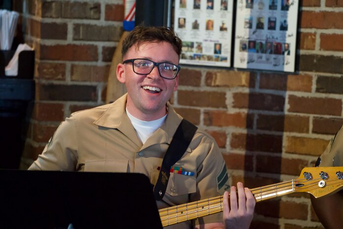 U.S. Marine Corps Cpl. Anthony Russo, bass guitarist with the 2nd Marine Aircraft Wing Band, popular music group, assigned to Special Purpose Marine Air-Ground Task Force-250 perform at Woodstock City, Georgia during Marine Week Atlanta, Aug. 30, 2025. Marines stationed across the globe commemorate the 250th anniversary of the Marine Corps, honoring a distinguished legacy of service, sacrifice, and unwavering fidelity to both the nation and the Corps. (U.S. Marine Corps photo by Gunny Sgt. Michael Newell)