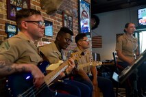 U.S. Marines with 2nd Marine Aircraft Wing Band, popular music group, assigned to Special Purpose Marine Air-Ground  Task Force-250 perform at Woodstock City, Georgia during Marine Week Atlanta, Aug. 30, 2025. Marines stationed across the globe commemorate the 250th anniversary of the Marine Corps, honoring a distinguished legacy of service, sacrifice, and unwavering fidelity to both the nation and the Corps. (U.S. Marine Corps photo by Gunny Sgt. Michael Newell)
