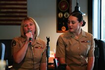 U.S. Marine Corps SSgt. Meggan Peel,(left) Sgt. Elizabeth Marino, vocalists with the 2nd Marine Aircraft Wing Band, popular music group, assigned to Special Purpose Marine Air-Ground Task Force-250 performs at Woodstock City, Georgia during Marine Week Atlanta, Aug. 30, 2025. Marines stationed across the globe commemorate the 250th anniversary of the Marine Corps, honoring a distinguished legacy of service, sacrifice, and unwavering fidelity to both the nation and the Corps. (U.S. Marine Corps photo by Cpl. Austin Closner)