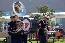 U.S. Marine Corps Sgt. Mathew Hale, (left) a tuba instrumentalist, Cpl. Zachary Haugland, (center) percussion instrumentalist, and Sgt. Peyton Scott, a percussion instrumentalist, with the 2nd Marine Aircraft Wing Band, brass band, assigned to Special Purpose Marine Air-Ground Task Force-250 perform at the static display during Marine Week Atlanta, Aug. 30, 2025. Marines stationed across the globe commemorate the 250th anniversary of the Marine Corps, honoring a distinguished legacy of service, sacrifice, and unwavering fidelity to both the nation and the Corps. (U.S. Marine Corps photo by Staff Sgt. Matthew Booth)
