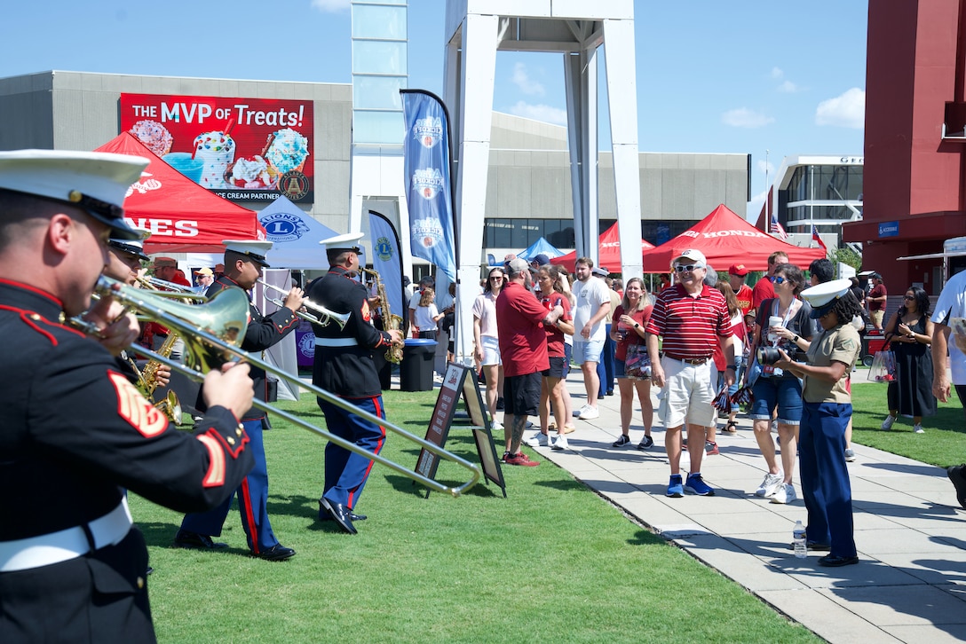U.S. Marines with the 2nd Marine Aircraft Wing Band, brass band, assigned to Special Purpose Marine Air-Ground Task Force-250 perform at the static display during Marine Week Atlanta, Aug. 31, 2025. Marines stationed across the globe commemorate the 250th anniversary of the Marine Corps, honoring a distinguished legacy of service, sacrifice, and unwavering fidelity to both the nation and the Corps. (U.S. Marine Corps photo by Cpl. Tannah Morris)