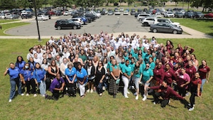 Members of the 87th Force Support Squadron Child Development Center staff pose for a group photo at Joint Base McGuire-Dix-Lakehurst, N.J., June 20, 2025. Toward the end of 2024, CDCs around the Department of Defense experienced a hiring freeze, and the JB MDL CDC staff worked to mitigate its impact and sustain operations. (Courtesy photo provided by the Child Development Center)