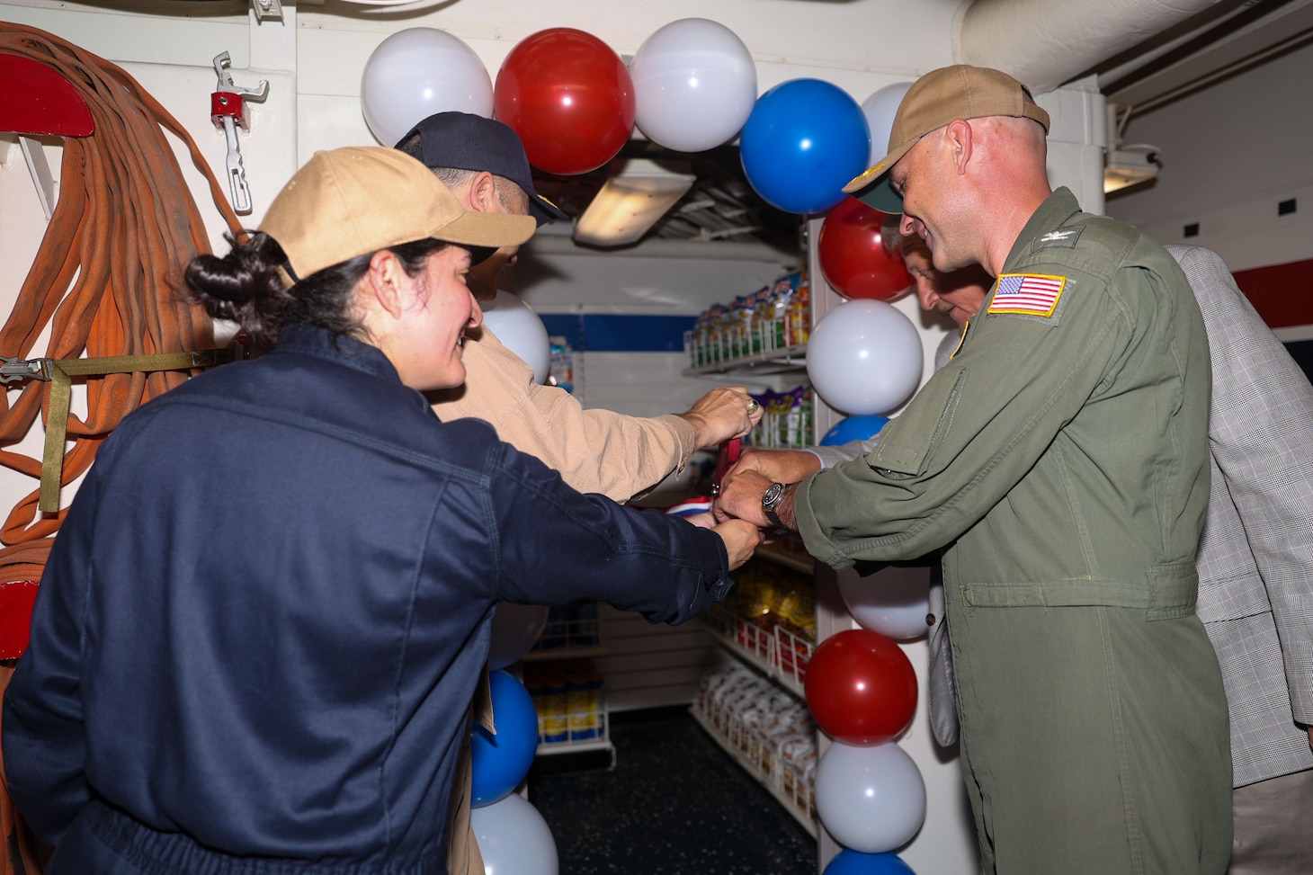Sailors assigned to the San Antonio-class Amphibious assault ship USS Isan Antonio (LPD 17) hold the grand opening of the self-serve satellite ship’s store. The new self-serve satellite store was created for Sailors to be able to purchase their favorite snacks outside of normal store hours and for a larger array of options than offered in the vending machines. San Antonio is one of the ships belonging to the Iwo Jima Amphibious Ready Group (ARG) which is capable of conducting global missions to accomplish U.S. strategic goals, deter adversaries, and ensure unimpeded commerce by keeping the high seas open and free in accordance with international law. Embarked aboard ARG shipping is the 22nd MEU (SOC) and provides a forward-deployed, flexible sea-based Marine Air Ground Task Force (MAGTF) capable of conducting amphibious operations—to include enabling the introduction of follow-on forces and designated special operations to meet Combatant Commander’s requirements. (U.S. Navy photo by Mass Communication Specialist 2nd Class Savannah L. Hardesty)
