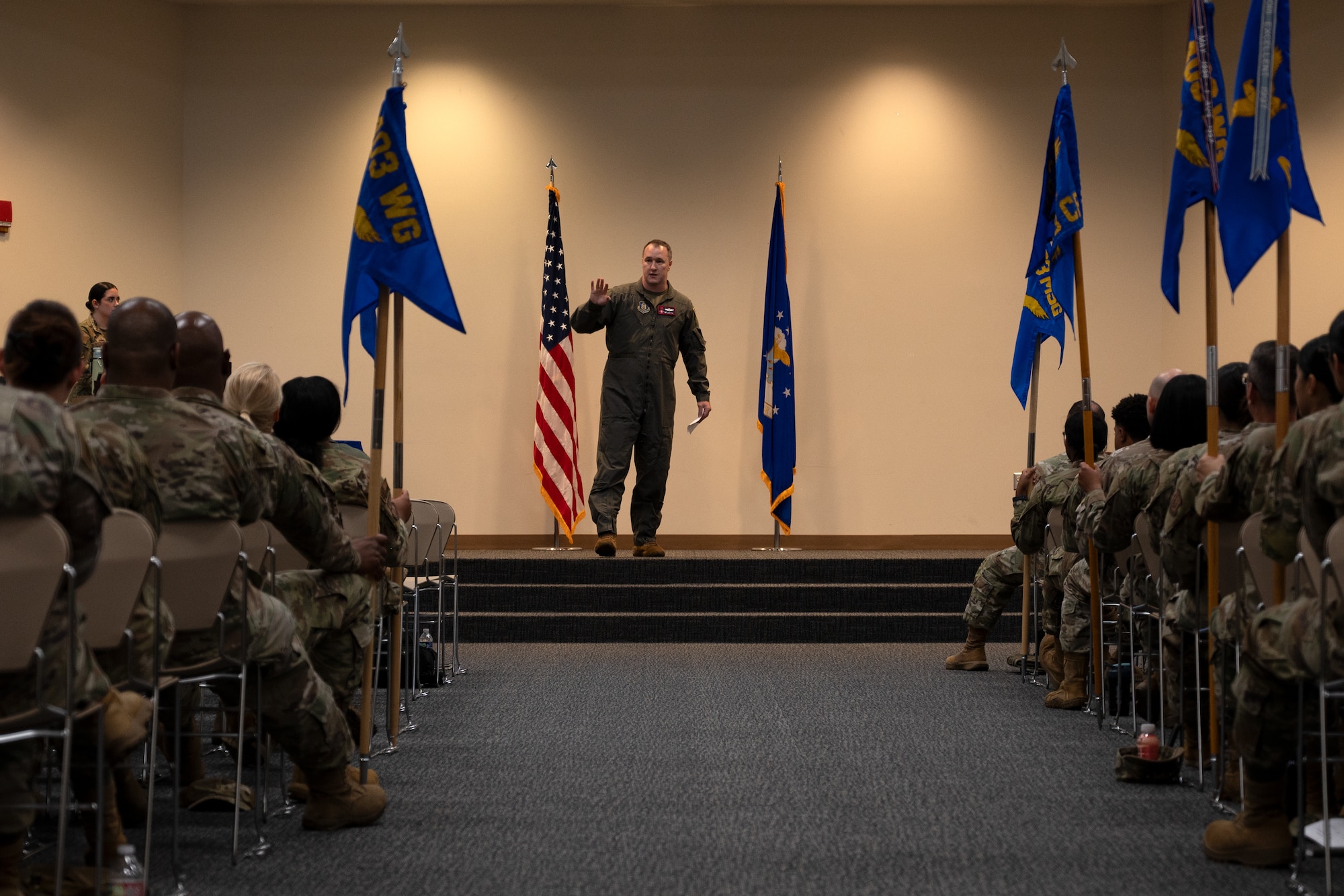 Col. Fish stands on stage as he addresses the 403rd Wing.