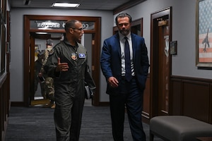 The commander of Air Combat Command and the Under Secretary of the Air Force speak during an immersion tour of Air Combat Command.