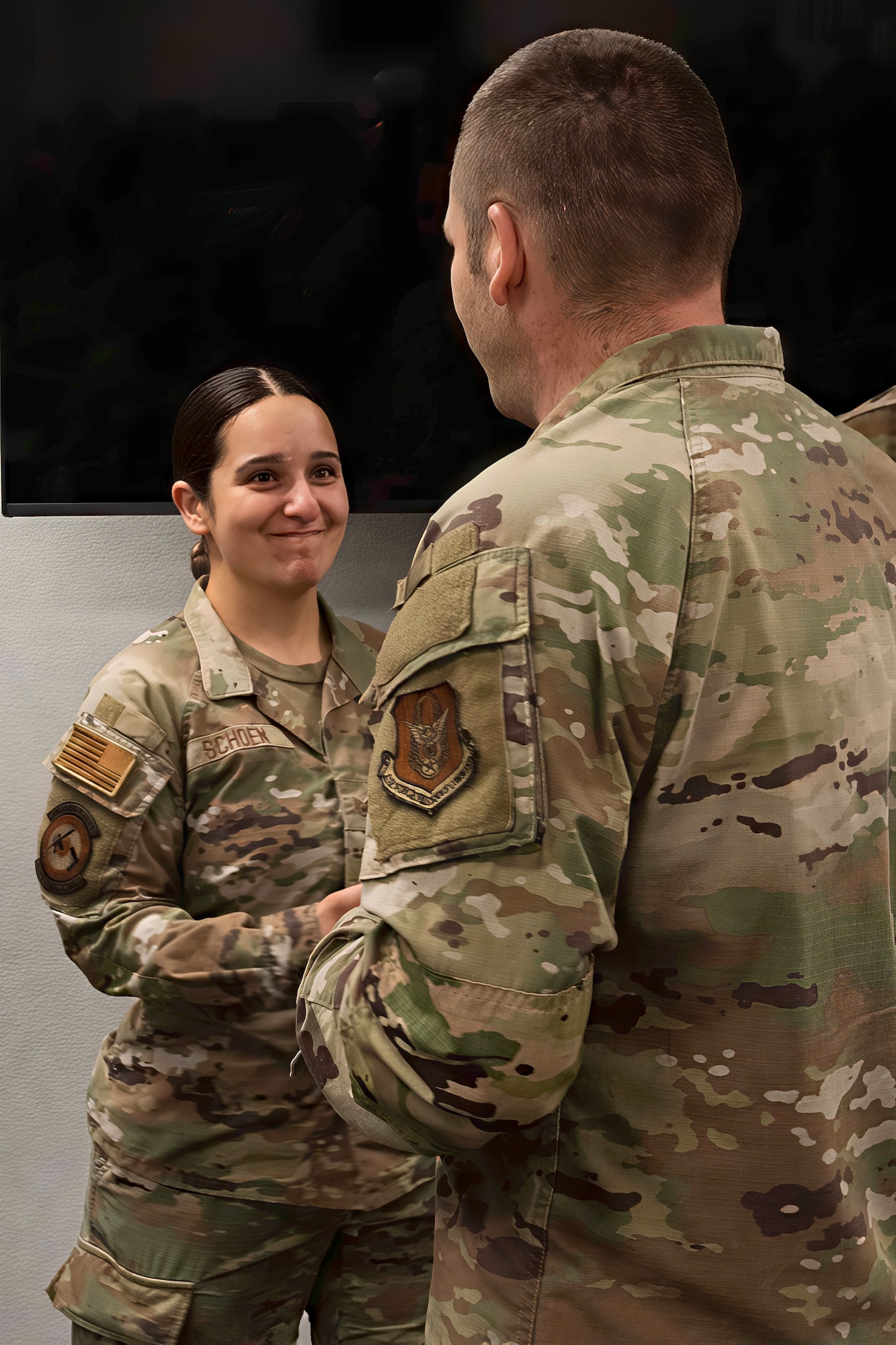U.S. Air Force Chief Master Sgt. Michael Roberts, Air Force Reserve Command Security Forces senior enlisted leader, coins Staff Sgt. Anna Schoen, assigned to the 307th SFS
