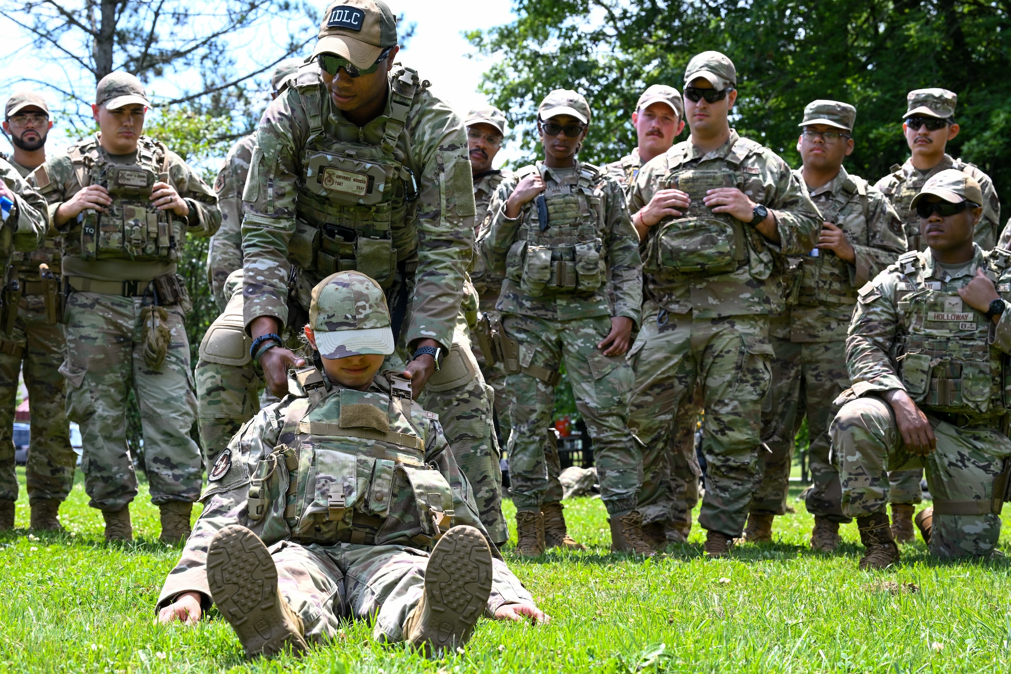 Tech. Sgt. Anfernee Morgan, a member of the 307th Security Forces Squadron at Barksdale Air Force Base, Louisiana, and member of the Integrated defense Leadership Course cadre, demonstrates methods for moving wounded wingmen during tactical combat casualty care training