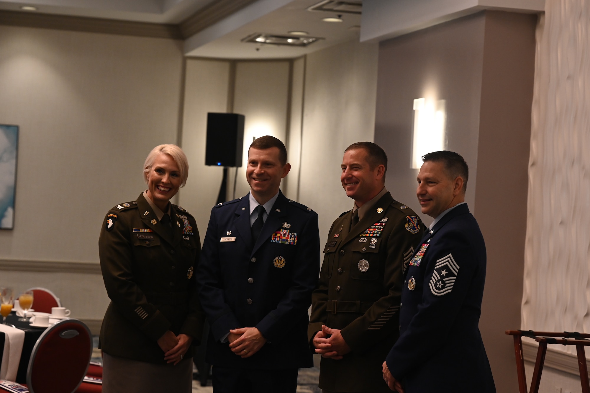 Four service members pose for a photo.
