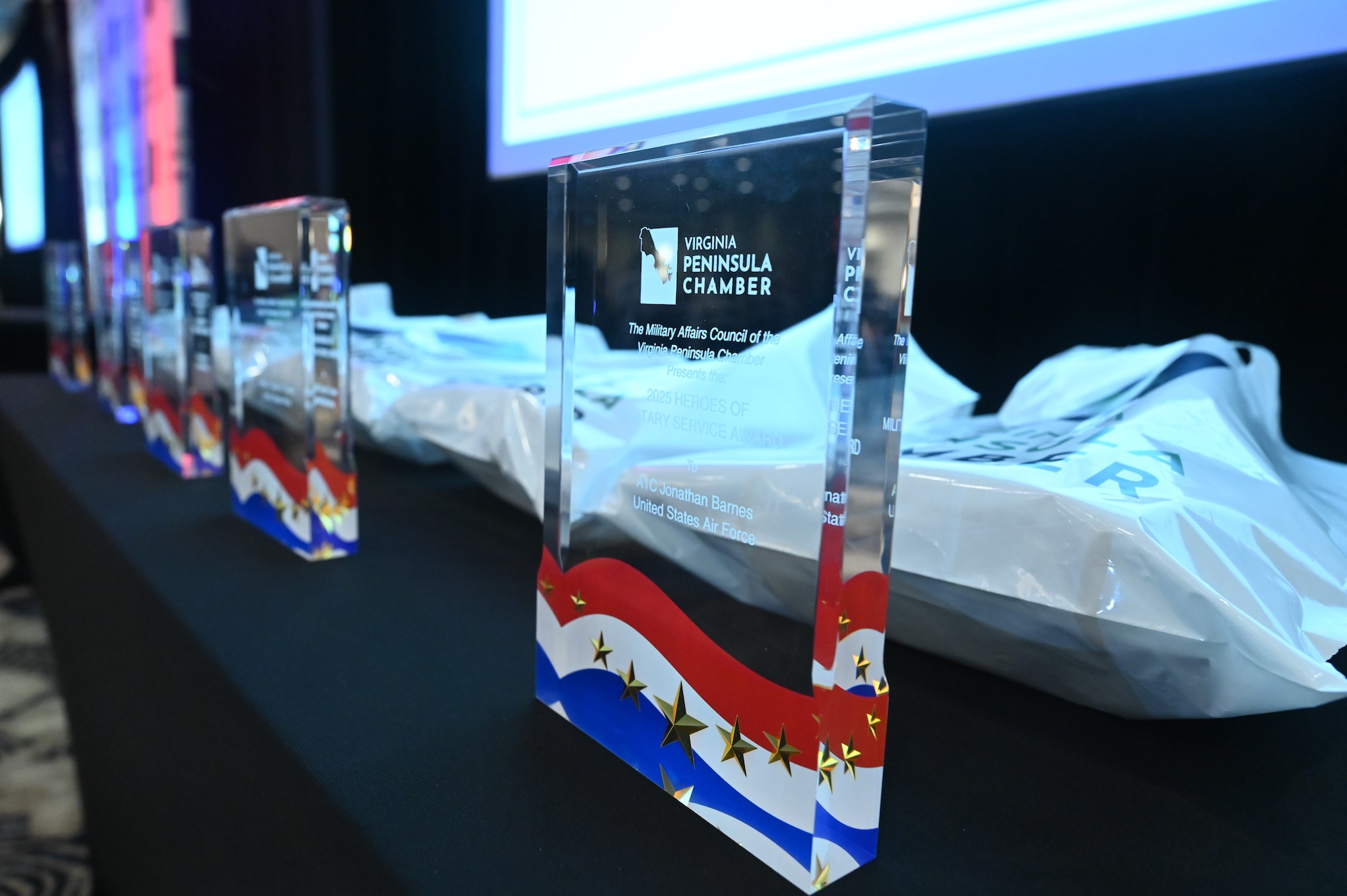 Trophies rest on a table.