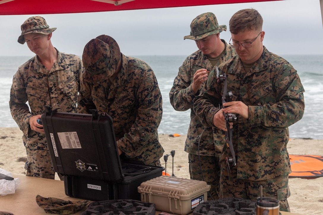 U.S. Marines with 1st Marine Division prepare to launch a small unmanned aircraft system during Project G.I. at Marine Corps Base Camp Pendleton, California, Aug. 26, 2025. The Defense Innovation Unit’s Project G.I. Challenge brought together Marines with I Marine Expeditionary Force, industry partners, and Department of Defense leaders to evaluate commercial sUAS, with Marine feedback shaping future procurement decisions and advancing modernization for contested environments. (U.S. Marine Corps photo by Lance Cpl. Sawyer Carleton)
