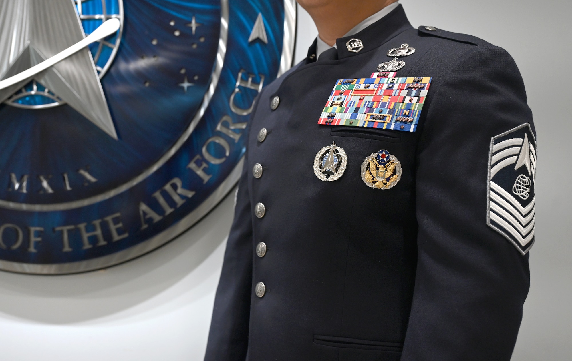 A military members shows his uniform.