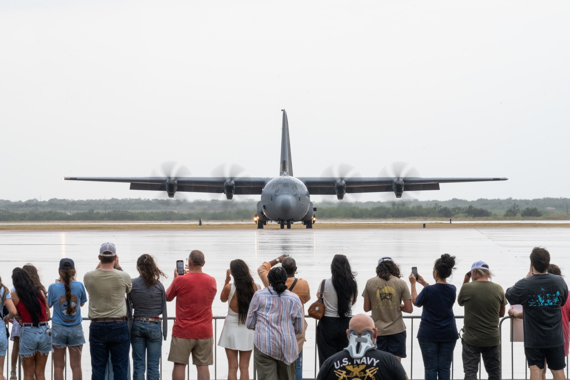 Friends and family members await the return of deployed Airmen from the 317th Airlift Wing at Dyess Air Force Base, Texas, Sept. 5, 2025. While deployed, the 40th Airlift Squadron played a critical role in supporting global mobility missions, flying the C-130J Super Hercules in support of joint operations, tactical airlift, and humanitarian efforts. (U.S. Air Force Photo by Airman 1st Class Caleb Schellenberg)